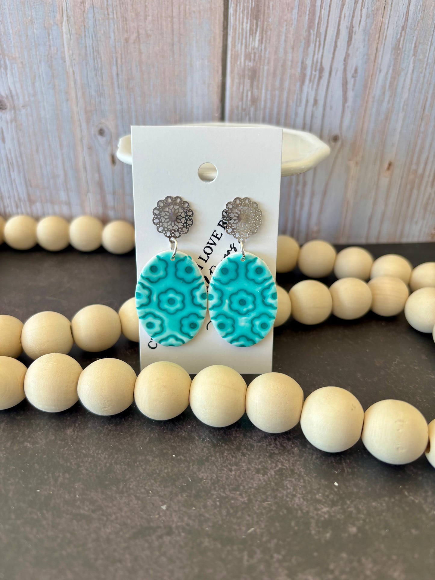 Embossed floral oval earrings
